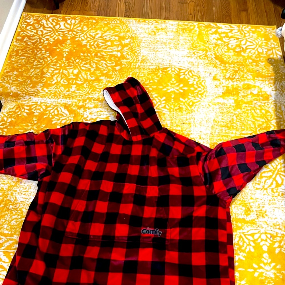 Red and black checkered comfy with white fur inside